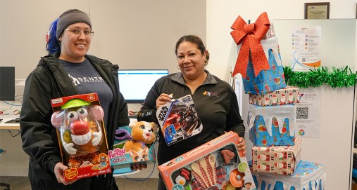 VRC Staff Holding Holiday Gifts